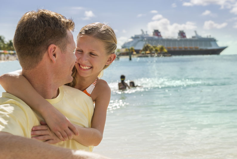 Father and daughter vacationing at Disney's Castaway Cay on a Disney Cruise Line Vacation booked by Main Street Magic, LLC., a no-fee travel agency specializing in Disney vacation planning | Authorized Disney Vacation Planner